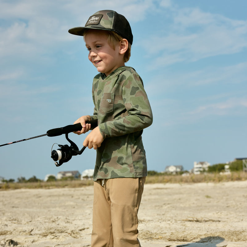 Kids New Arrivals - kid smiling in button down Poncho Outdoors shirt