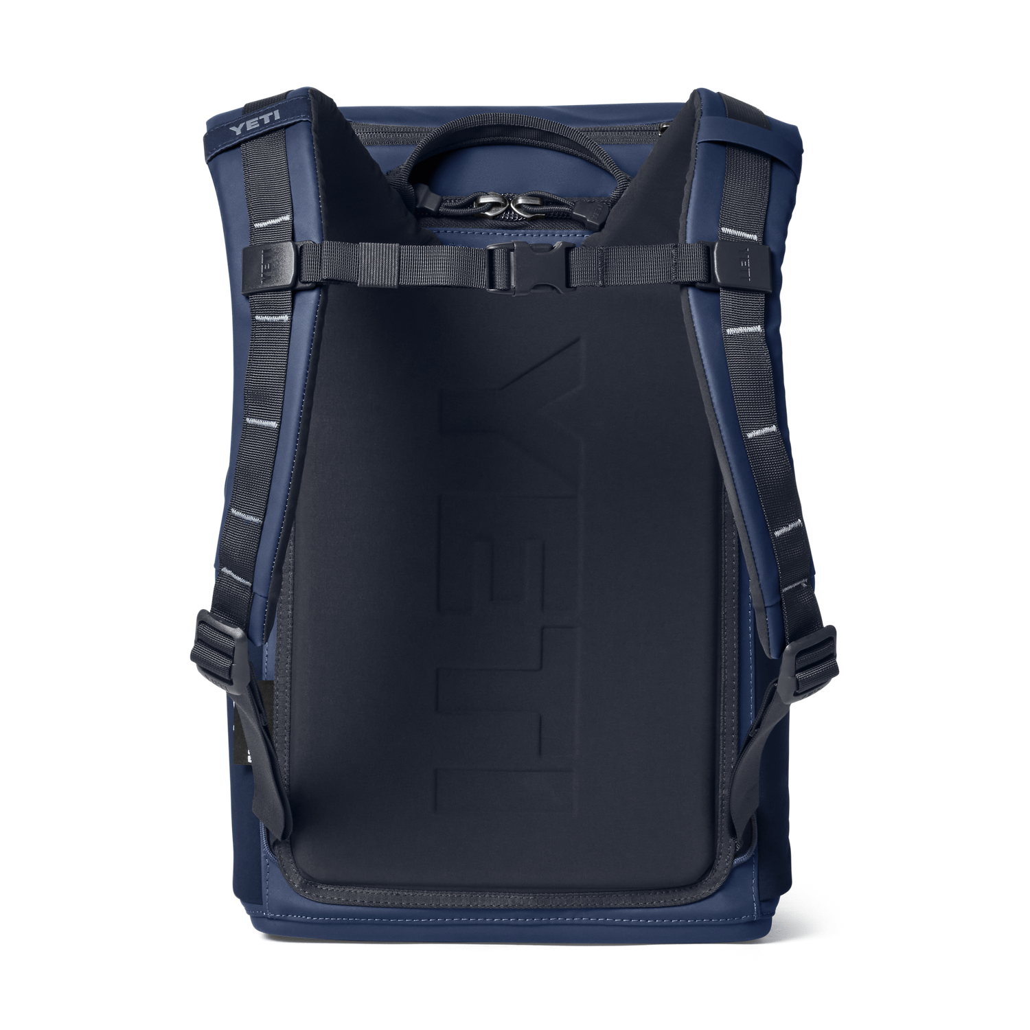 A YETI backpack shown from the back, featuring a dark navy blue padded main compartment with embossed branding, dark blue side panels, and black shoulder straps with silver reflective stitching, set against a plain white background.