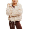 Woman wearing a beige jacket with a white background