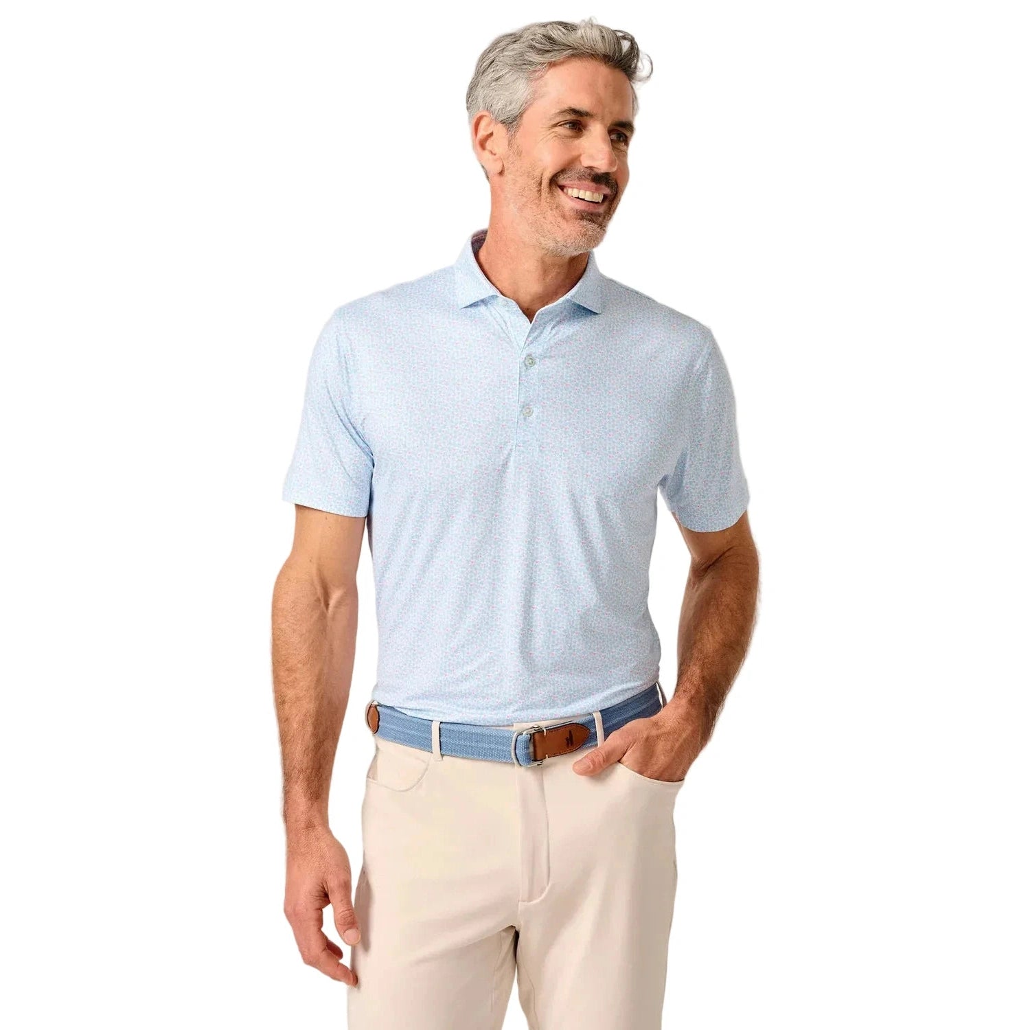 Man wearing a light blue polo shirt and beige pants on a white background