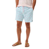 Light blue shorts with pink flamingo pattern worn by a person on a white background