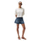 Woman wearing a white t-shirt and denim shorts on a white background
