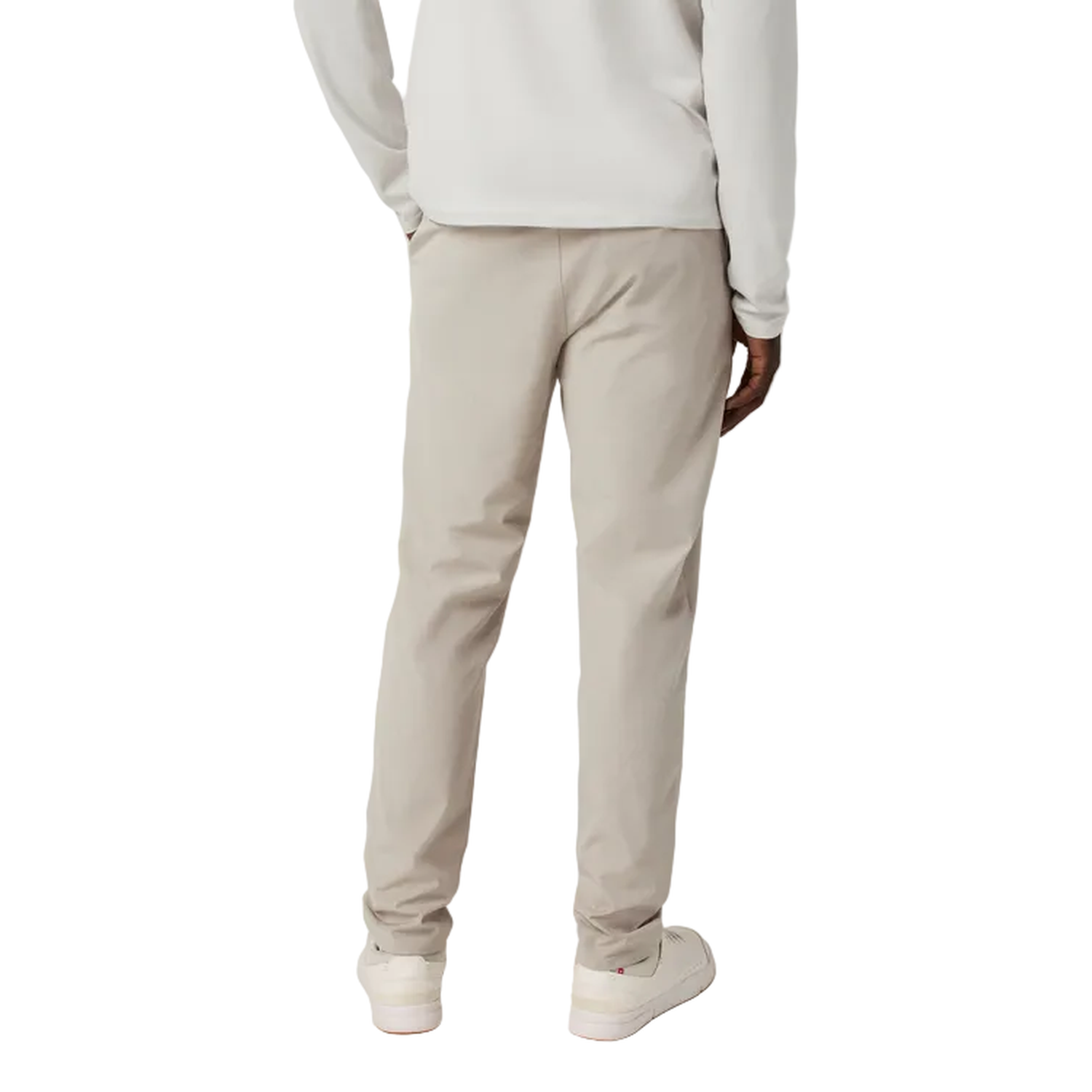 Person wearing beige pants and a light gray sweatshirt on a white background
