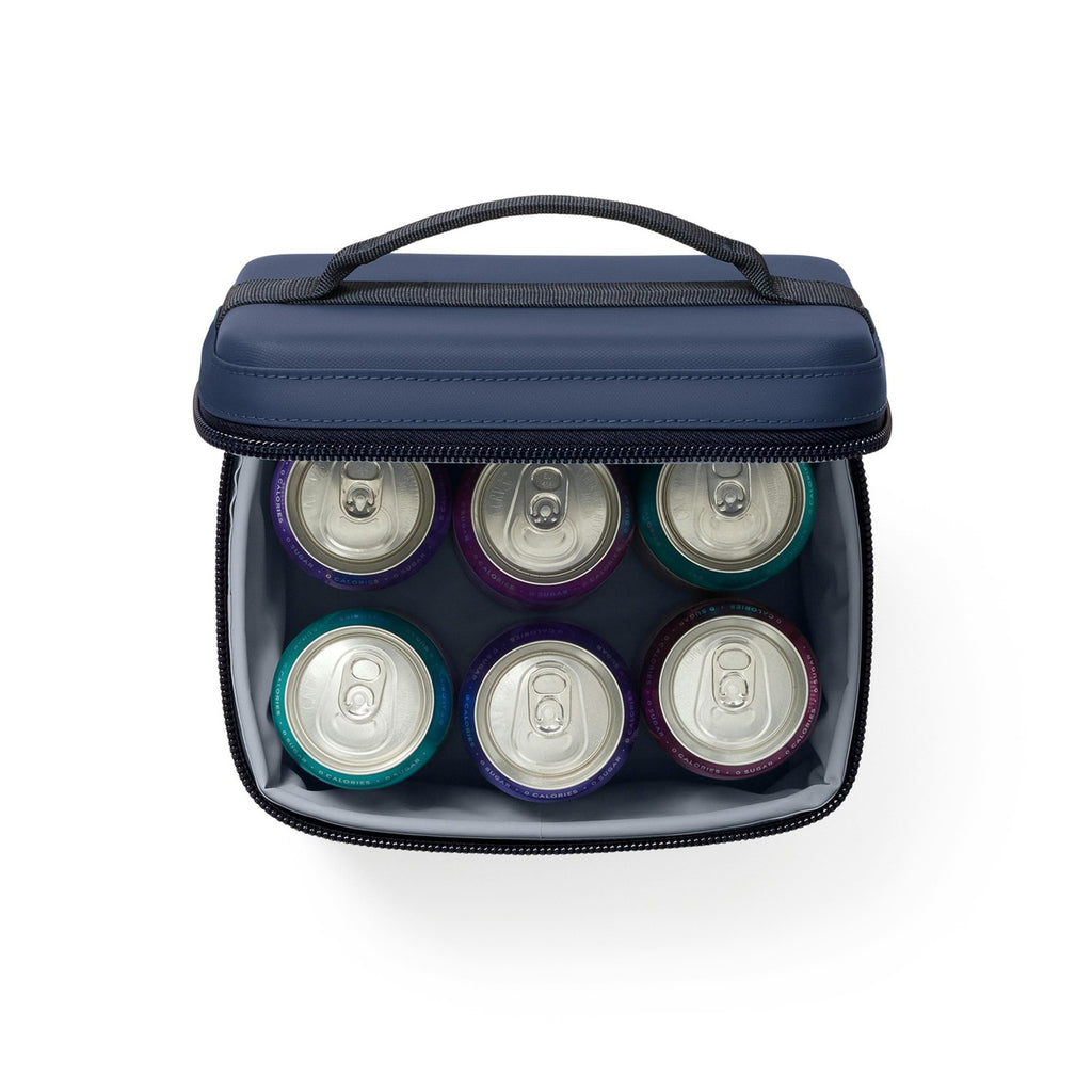 YETI Daytrip 3L Snack Box in Classic Navy, open with cans