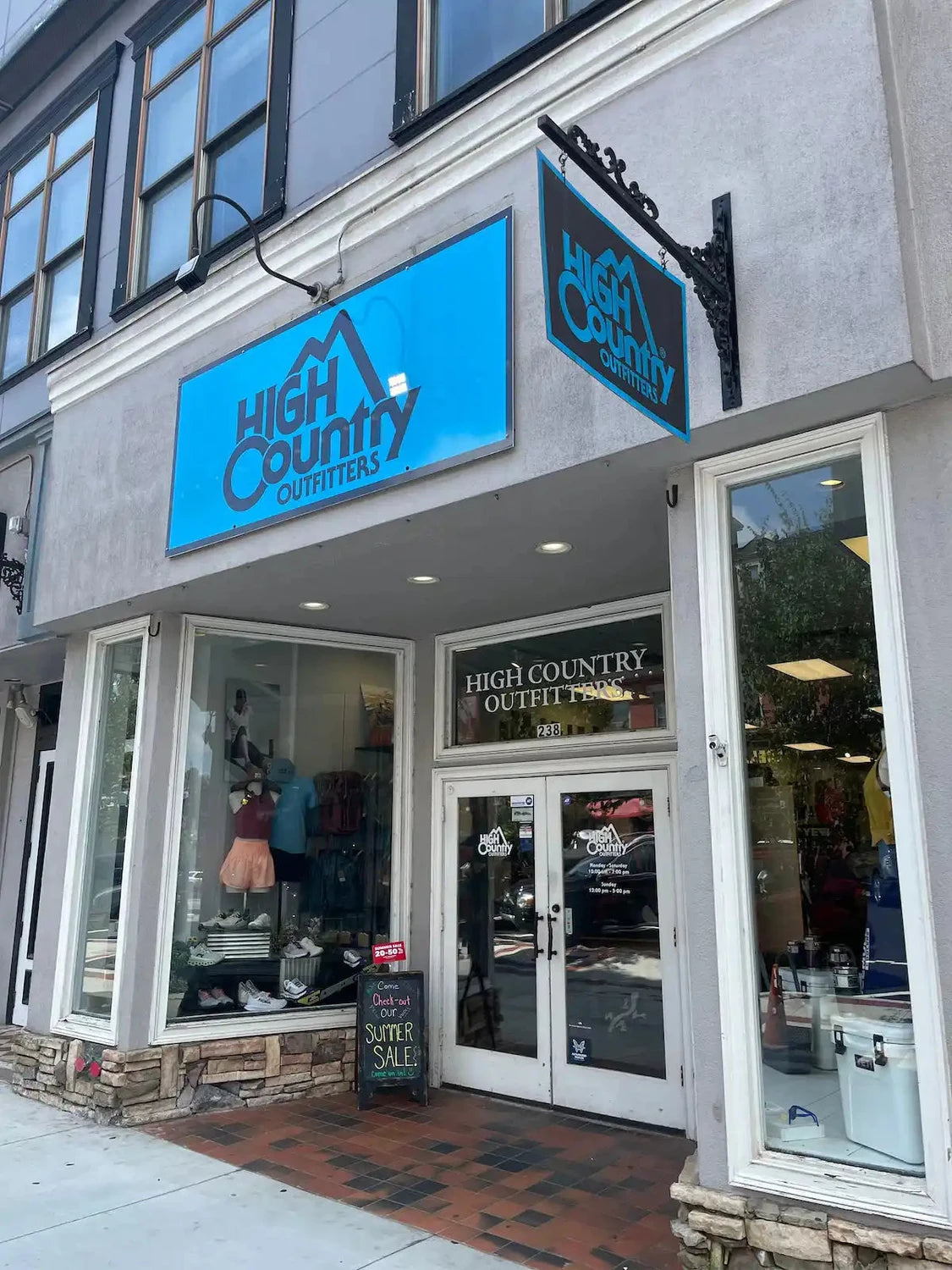 High Country Outfitters storefront with a bright blue sign.