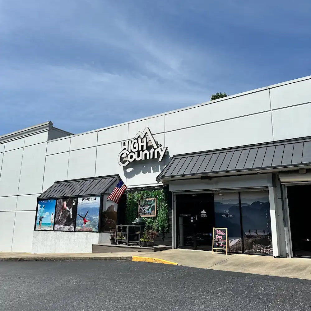 High Country store exterior with white walls and dark roof trim.