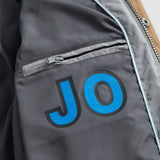 johnnie-O 01. MENS APPAREL - MENS JACKETS - MENS JACKETS INSULATED Men's Juno Quilted Snap Jacket CONCRETE