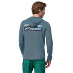 Patagonia 01. MENS APPAREL - MENS LS SHIRTS - MENS LS HOODY Men's Capilene® Cool Daily Graphic Hoody BLUX BOARDSHORT LOGO|UTILITY BLUE X-DYE
