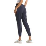 Vuori 02. WOMENS APPAREL - WOMENS PANTS - WOMENS PANTS ACTIVE Women's Performance Jogger - Long HMD MIDNIGHT HEATHER